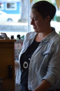 Andrea standing at our front counter