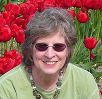 Shirley with red tulips in the background